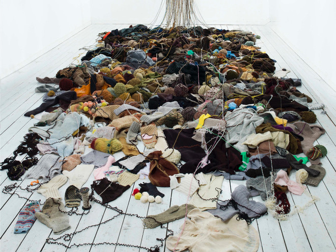 "After The Market" 2009.
Installation, unravelled knitted wool clothes / knitted image after the painting The Gleaners  (1857) Jean-Francois Millet. Photo: M.Tomaszewicz. Courtesy: The National Museum of Art, Architecture and Design, Norway.  

