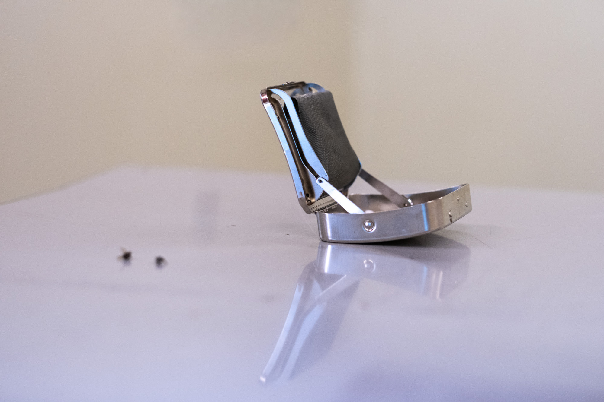 Øvelser i samhandling. Two flies, home grown Virginia-tobacco and cigarette case. Detail from site-specific sculpture by Miriam Hansen and Andreas Olavssønn Rongen, installed in the office building at Velferden as a part of Mutant Prospects. Photo by Tiny Productions for Coast Contemporary.