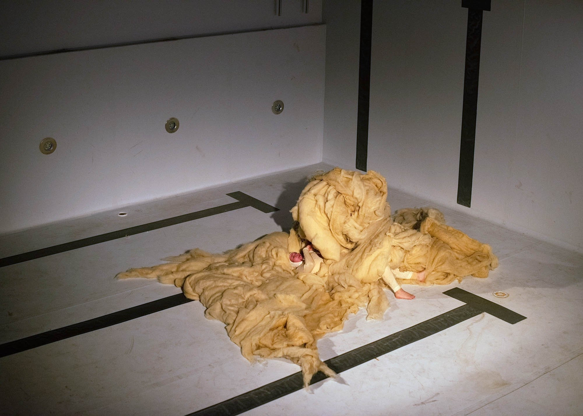 Woolwalker. Performance by Marita Isobel Solberg at Alfehim Public Bath in Tromsø, 2022. Photo: Mihaly Stefanovic.