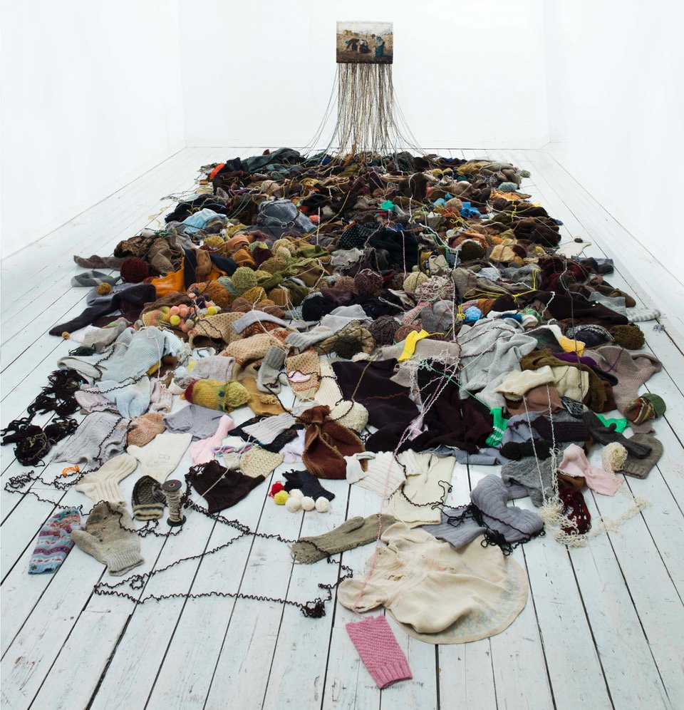 "After The Market" 2009.
Installation, unravelled knitted wool clothes / knitted image after the painting The Gleaners  (1857) Jean-Francois Millet. Photo: M.Tomaszewicz. Courtesy: The National Museum of Art, Architecture and Design, Norway.  
